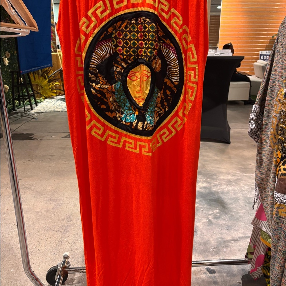 Vibrant Red Dress with Artistic Face Design